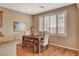 Cozy dining area with a modern wood table set, comfortable seating, and bright natural light at 1908 Morro Vista Dr, Las Vegas, NV 89135