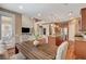 Kitchen and dining area features stainless steel appliances, granite countertops, island seating, and a Gathering room view at 1908 Morro Vista Dr, Las Vegas, NV 89135