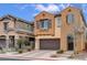 Beautiful two-story home featuring a two-car garage, desert landscaping, and decorative window shutters at 1908 Morro Vista Dr, Las Vegas, NV 89135