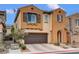 Two-story home showcasing a stylish exterior and a two-car garage at 1908 Morro Vista Dr, Las Vegas, NV 89135