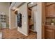 Hallway features an incorporated desk, storage cabinetry, wood-look floors and neutral color palette at 1908 Morro Vista Dr, Las Vegas, NV 89135