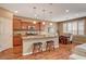 Eat-in kitchen featuring granite counters, stainless appliances, and a cozy breakfast bar with seating at 1908 Morro Vista Dr, Las Vegas, NV 89135