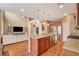Open kitchen with granite counters, island with seating, and stainless steel appliances at 1908 Morro Vista Dr, Las Vegas, NV 89135