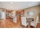 Open kitchen with stainless steel appliances, granite countertops, and an adjacent dining area at 1908 Morro Vista Dr, Las Vegas, NV 89135