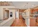 Open kitchen with granite countertops, stainless steel appliances, and wood-look floors at 1908 Morro Vista Dr, Las Vegas, NV 89135