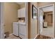 Convenient laundry room with modern washer and dryer set, next to bedroom at 1908 Morro Vista Dr, Las Vegas, NV 89135