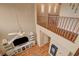 Bright living area showcasing a cozy fireplace, built-in shelving, and a second-floor view at 1908 Morro Vista Dr, Las Vegas, NV 89135