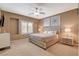 Relaxing main bedroom featuring neutral tones, a ceiling fan, and a bright window at 1908 Morro Vista Dr, Las Vegas, NV 89135