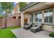 Enjoyable patio with seating, well-manicured lawn, and privacy wall creates the perfect atmosphere at 1908 Morro Vista Dr, Las Vegas, NV 89135