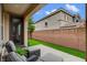 Relaxing patio with seating, well-manicured lawn, and privacy wall for outdoor living at 1908 Morro Vista Dr, Las Vegas, NV 89135