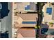 Aerial view of terracotta tiled roofs, some with solar panels, in a well-maintained residential area at 1908 Morro Vista Dr, Las Vegas, NV 89135