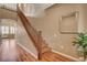 Elegant staircase features wood railing and steps, complementing the home's neutral color palette at 1908 Morro Vista Dr, Las Vegas, NV 89135