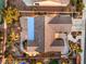 Aerial view of a house displaying the roof, landscaping, courtyard, and garden area including a putting green at 1992 Fort Halifax St, Henderson, NV 89052