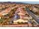 Aerial view of homes in a neighborhood with meticulous landscaping, desert foliage and mountain views in the background at 1992 Fort Halifax St, Henderson, NV 89052