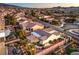 Aerial view of a home in a neighborhood with meticulous landscaping, desert foliage and mountain views in the background at 1992 Fort Halifax St, Henderson, NV 89052