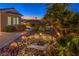 Scenic backyard pond features tropical landscaping, mountain views, and an enchanting outdoor ambiance at 1992 Fort Halifax St, Henderson, NV 89052