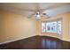Bedroom features wood floors, a ceiling fan, and natural light from the bay windows at 1992 Fort Halifax St, Henderson, NV 89052