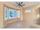 Cozy bedroom featuring a bay window with plantation shutters and tiled floor at 1992 Fort Halifax St, Henderson, NV 89052