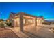 Exterior features desert landscaping and a covered patio, perfect for outdoor living and entertaining at 1992 Fort Halifax St, Henderson, NV 89052