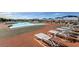 Outdoor pool area with lounge chairs, umbrellas, and a scenic view of mountains in the distance at 1992 Fort Halifax St, Henderson, NV 89052