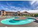 Exterior view of the pool, and the community building in the background at 1992 Fort Halifax St, Henderson, NV 89052
