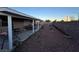 Spacious backyard with gravel ground cover offers privacy and low maintenance landscaping at 213 Beaver Ridge Ave, North Las Vegas, NV 89031