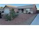 Charming single-story home featuring desert landscaping and a classic tile roof at 213 Beaver Ridge Ave, North Las Vegas, NV 89031