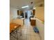 Bright kitchen with tile flooring, wooden cabinets, and stainless steel appliances at 213 Beaver Ridge Ave, North Las Vegas, NV 89031