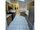 Updated kitchen featuring stainless steel appliances and ample counter space at 213 Beaver Ridge Ave, North Las Vegas, NV 89031
