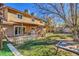 Large backyard featuring a covered patio, mature trees, lawn and a sandbox at 2233 Marlboro Dr, Henderson, NV 89014