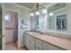 Bright bathroom with a long vanity, framed mirrors, and shower/toilet room at 2233 Marlboro Dr, Henderson, NV 89014