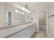 Well-lit bathroom featuring an expansive countertop, single sink and a separate shower/tub at 2233 Marlboro Dr, Henderson, NV 89014