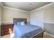 Comfortable bedroom with a wooden bed frame, soft carpet, and a closet with bi-fold doors at 2233 Marlboro Dr, Henderson, NV 89014