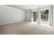Bright bedroom with sliding doors leading to the backyard, enhancing the indoor-outdoor living experience at 2233 Marlboro Dr, Henderson, NV 89014