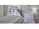 Bright bedroom with carpet, sliding glass doors to backyard, and baby items at 2233 Marlboro Dr, Henderson, NV 89014