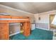 Fun bedroom with a loft bed, green carpet, and built-in storage; plenty of space for activities at 2233 Marlboro Dr, Henderson, NV 89014