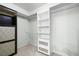 Organized walk-in closet features built-in shelving and ample storage, maximizing space at 2233 Marlboro Dr, Henderson, NV 89014