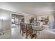 Open dining room connecting to a living area and kitchen, perfect for entertaining at 2233 Marlboro Dr, Henderson, NV 89014
