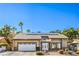 Charming single-story home with a two car garage, desert landscaping, and solar panels on the roof at 2233 Marlboro Dr, Henderson, NV 89014