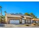 Single-story home featuring a well-maintained lawn and a two-car garage, enhancing curb appeal at 2233 Marlboro Dr, Henderson, NV 89014