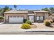 Charming single-story home with well-manicured landscaping and a two-car garage in a residential neighborhood at 2233 Marlboro Dr, Henderson, NV 89014