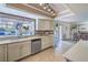 Bright kitchen features stainless steel appliances, ample counter space, and a view to the outdoor living area at 2233 Marlboro Dr, Henderson, NV 89014