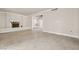 Spacious living room with decorative fireplace, neutral paint, and tile flooring throughout at 2233 Marlboro Dr, Henderson, NV 89014