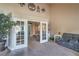 Spacious living room with French doors, comfortable seating, and carpeted floors, perfect for relaxation at 2233 Marlboro Dr, Henderson, NV 89014
