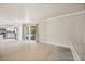 Bright living room boasts tile flooring, neutral paint, and sliding glass doors to outdoor space at 2233 Marlboro Dr, Henderson, NV 89014