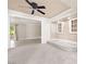 Cozy living area with carpet, recessed lighting, and access to the sunroom with sliding glass doors at 2233 Marlboro Dr, Henderson, NV 89014