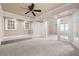 Bright living area with carpet, French doors, recessed lights and wide access to adjoining living spaces at 2233 Marlboro Dr, Henderson, NV 89014