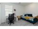 Cozy bedroom featuring a daybed, desk with natural light, and neutral colored carpet at 2665 Piroli St, Henderson, NV 89044