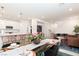 Bright dining area featuring stylish table setting, and seamless flow to kitchen at 2665 Piroli St, Henderson, NV 89044