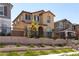 Inviting two-story home showcasing stucco facade, tile roof, and a landscaped front yard enclosed by a wrought iron fence at 2665 Piroli St, Henderson, NV 89044
